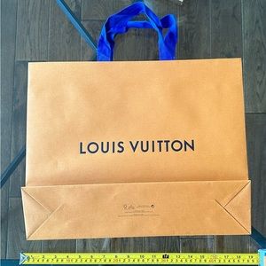 Louis Vuitton carrying bag for books.